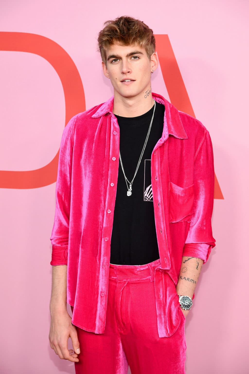 Presley Gerber is pictured attending a public event in a vivid pink corduroy ensemble, years before his death at age 27 in September 2026. | Source: Getty Images